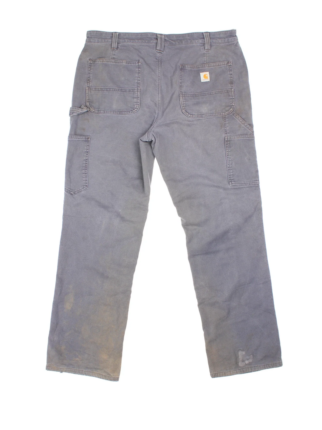 Carhartt Fleece Lined Carpenter Jeans in a grey colourway with multiple pockets and the logo embroidered on the back.