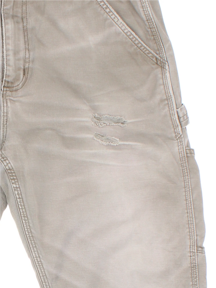 Carhartt Carpenter Trousers in a grey colourway with multiple pockets and the logo embroidered on the back.