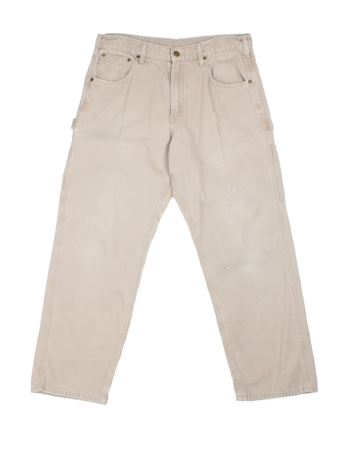 Carhartt Carpenter Trousers in a tan colourway with multiple pockets and the logo embroidered on the back.