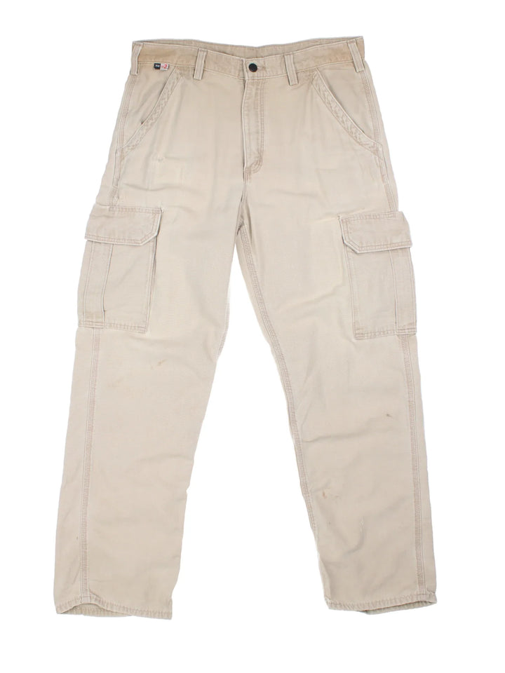 Carhartt Cargo Trousers in a tan colourway with multiple pockets and the logo embroidered on the back.