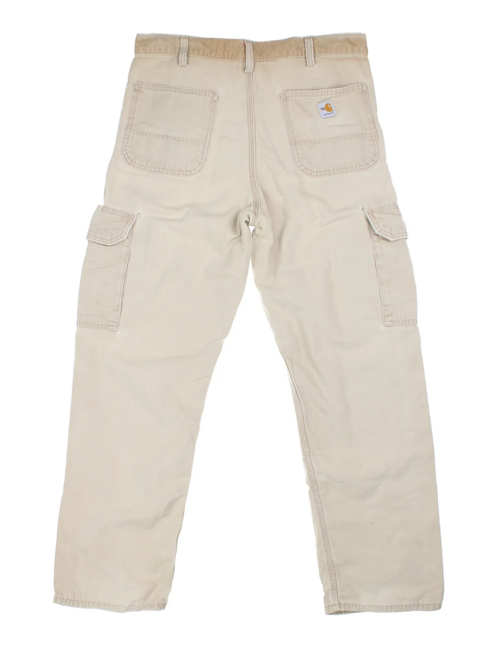 Carhartt Cargo Trousers in a tan colourway with multiple pockets and the logo embroidered on the back.