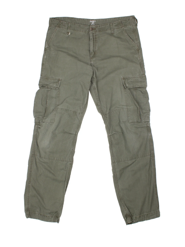 Carhartt Cargo Trousers in a green colourway with multiple pockets and the logo embroidered on the back.