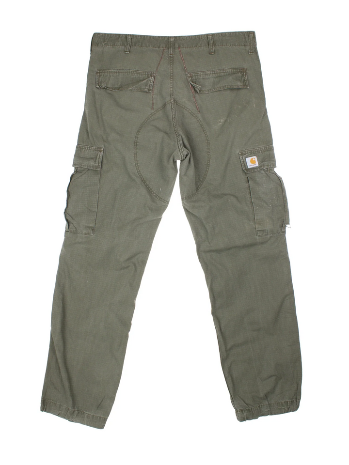 Carhartt Cargo Trousers in a green colourway with multiple pockets and the logo embroidered on the back.