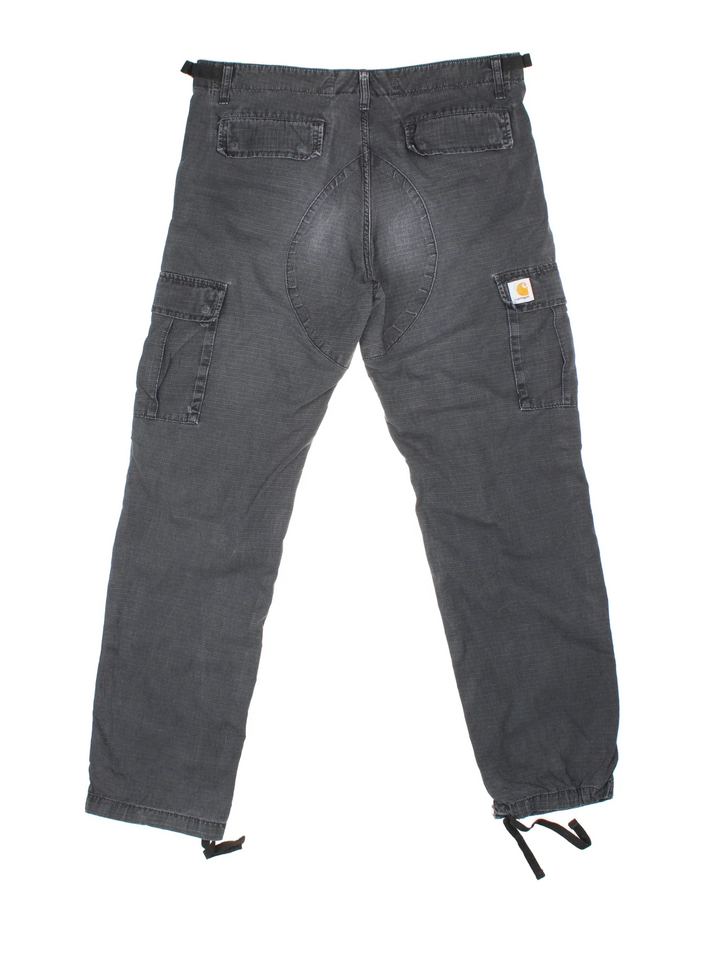 Carhartt Cargo Trousers in a black colourway with multiple pockets and the logo embroidered on the back.