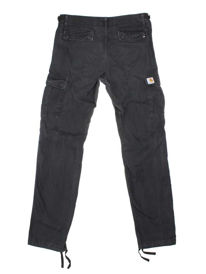 Carhartt Cargo Trousers in a black colourway with multiple pockets and the logo embroidered on the back.