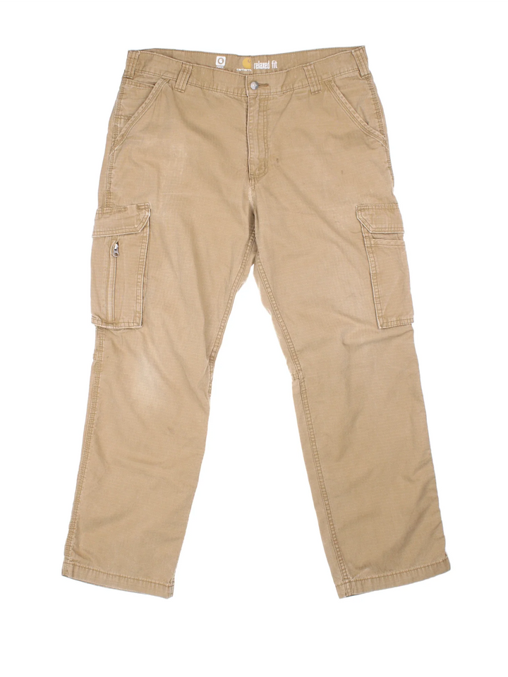Carhartt Cargo Trousers in a tan colourway with multiple pockets and the logo embroidered on the back.