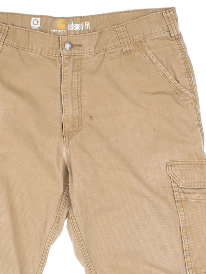 Carhartt Cargo Trousers in a tan colourway with multiple pockets and the logo embroidered on the back.