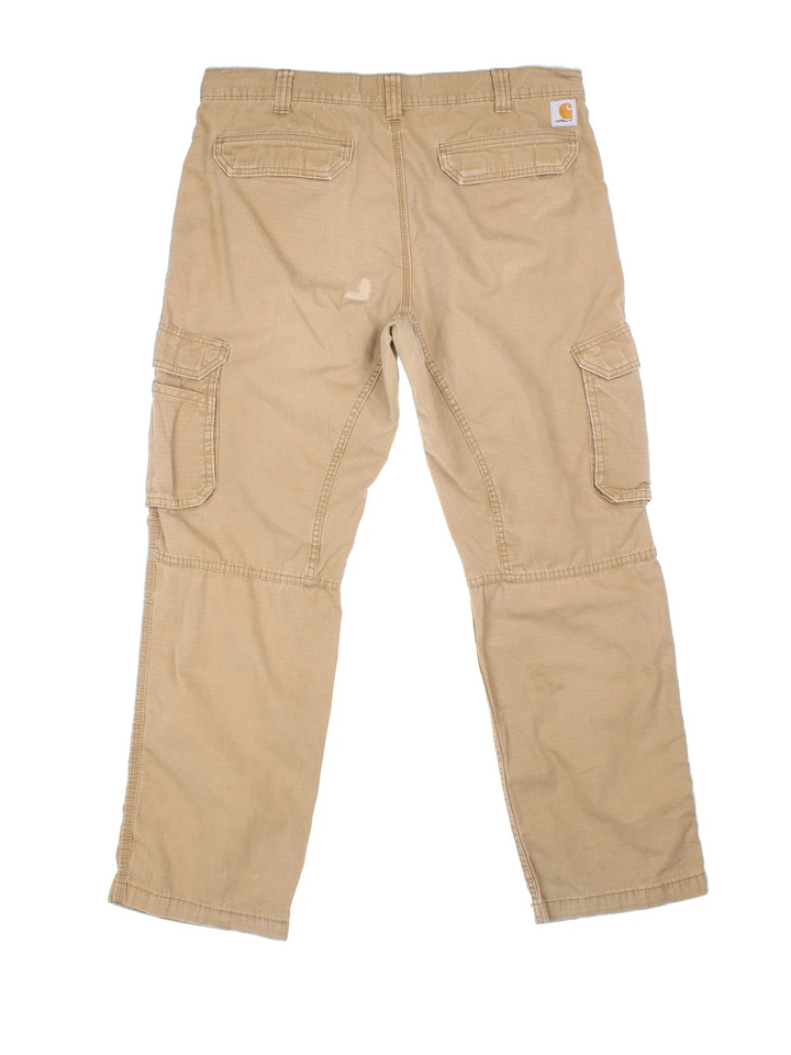Carhartt Cargo Trousers in a tan colourway with multiple pockets and the logo embroidered on the back.