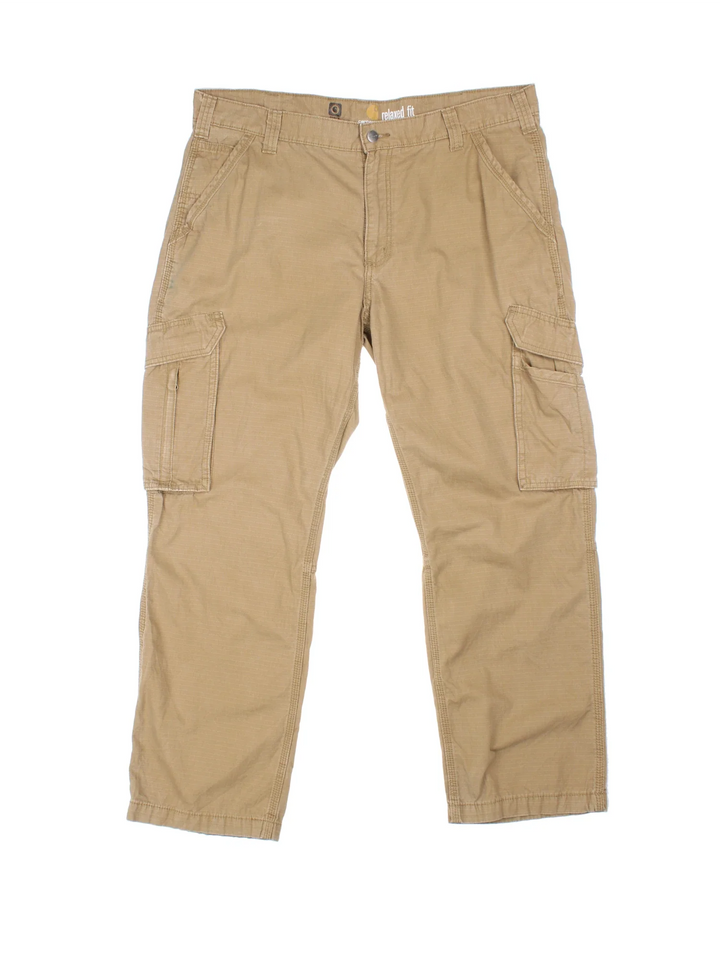 Carhartt Cargo Trousers in a tan colourway with multiple pockets and the logo embroidered on the back.