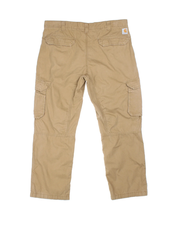 Carhartt Cargo Trousers in a tan colourway with multiple pockets and the logo embroidered on the back.