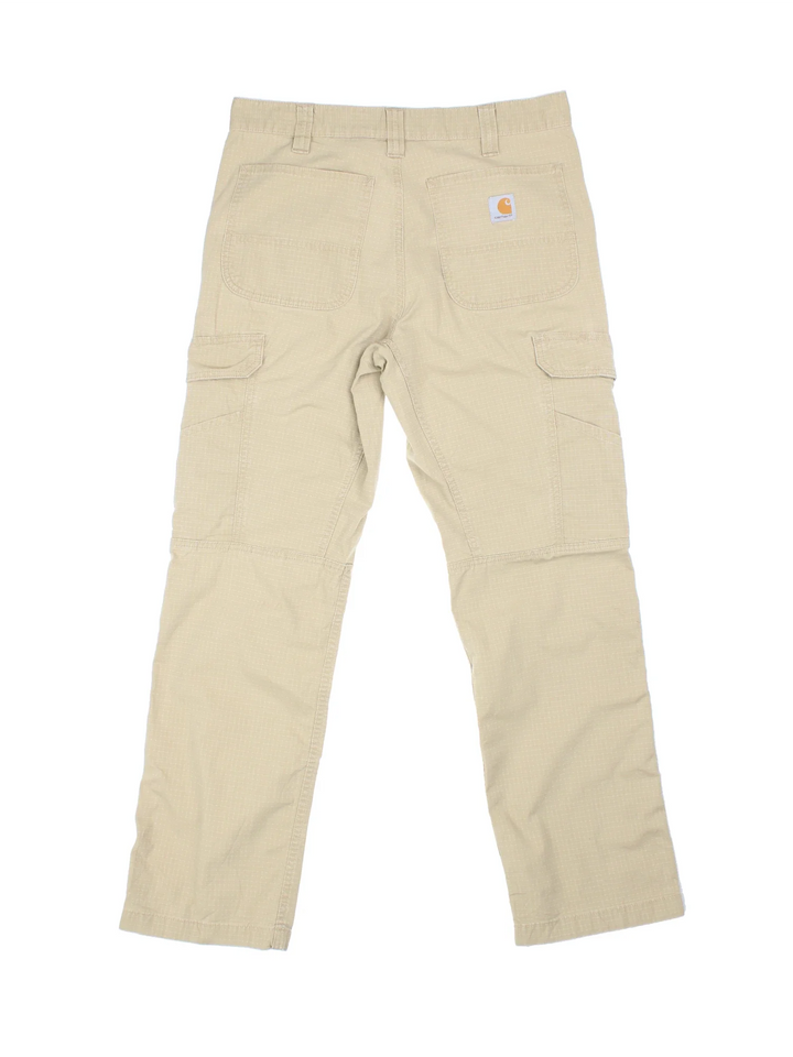 Carhartt Cargo Trousers in a tan colourway with multiple pockets and the logo embroidered on the back.