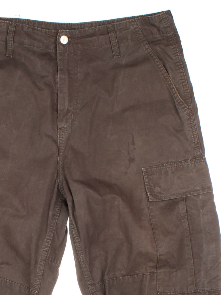 Carhartt Cargo Trousers in a brown colourway with multiple pockets and the logo embroidered on the back.