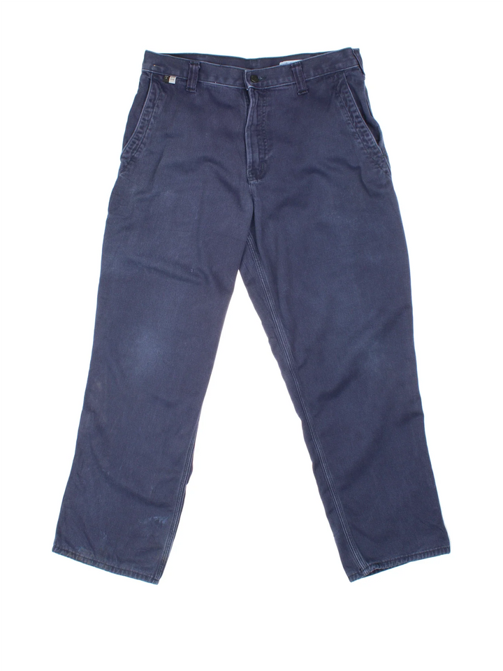 Carhartt Jeans in a blue colourway with multiple pockets and the logo embroidered on the back.