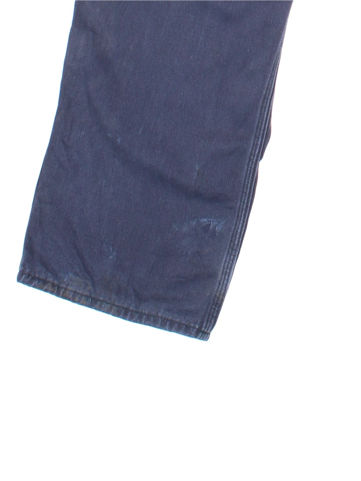 Carhartt Jeans in a blue colourway with multiple pockets and the logo embroidered on the back.