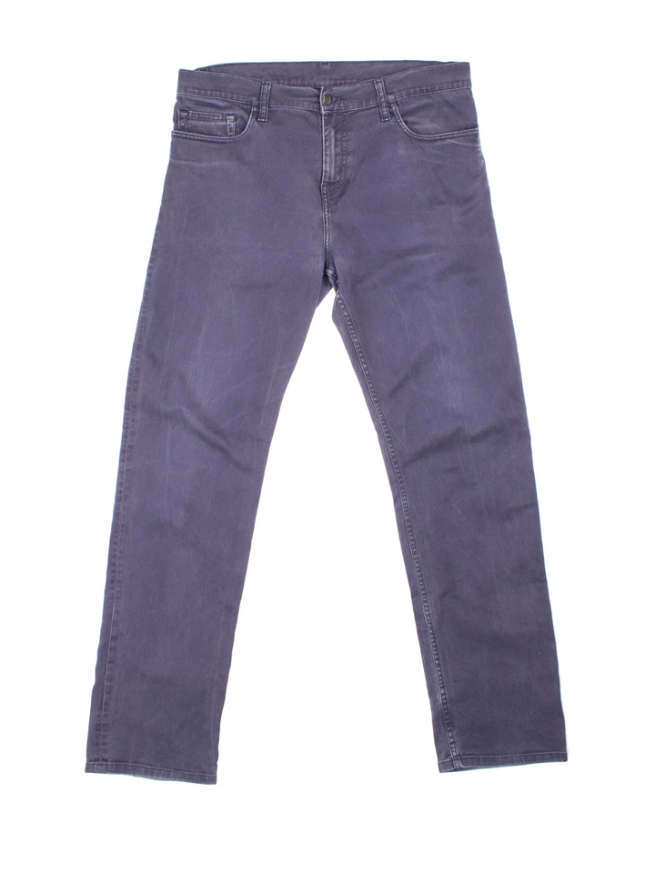 Carhartt Jeans in a blue colourway with multiple pockets and the logo embroidered on the back.