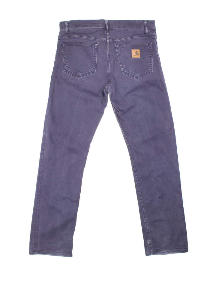 Carhartt Jeans in a blue colourway with multiple pockets and the logo embroidered on the back.