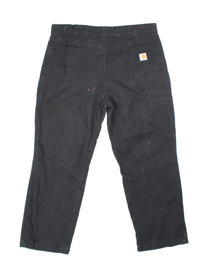 Carhartt Trousers in a black colourway with multiple pockets and the logo embroidered on the back.