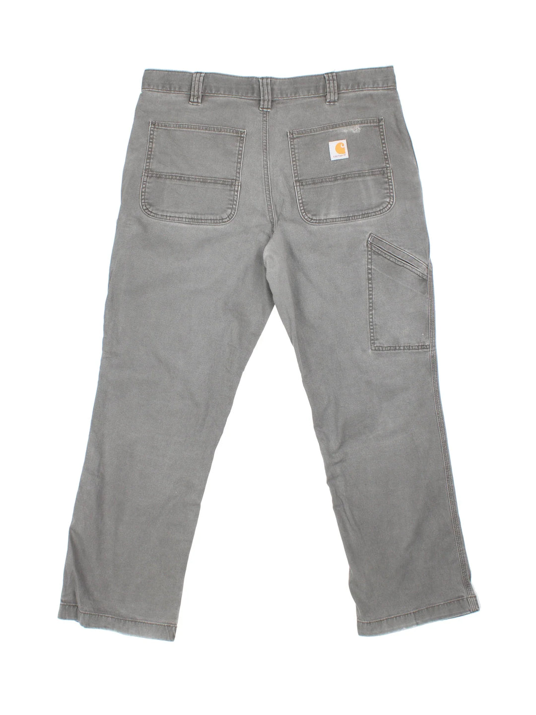 Carhartt Trousers in a grey colourway with multiple pockets and the logo embroidered on the back.