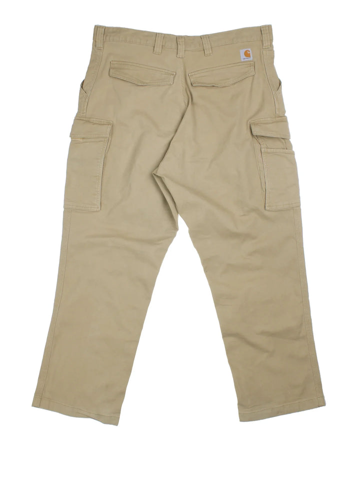 Carhartt Cargo Trousers in a tan colourway with multiple pockets and the logo embroidered on the back.