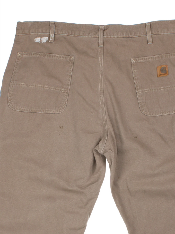 Carhartt Trousers in a brown colourway with multiple pockets and the logo embroidered on the back.