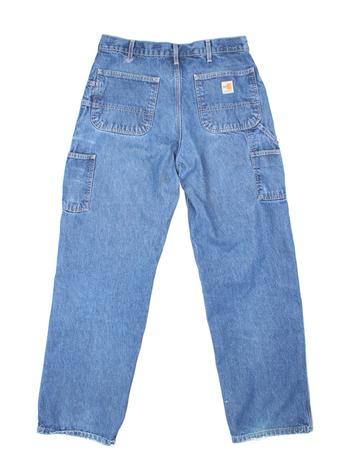 Carhartt Carpenter Jeans in a blue colourway with multiple pockets and the logo embroidered on the back.