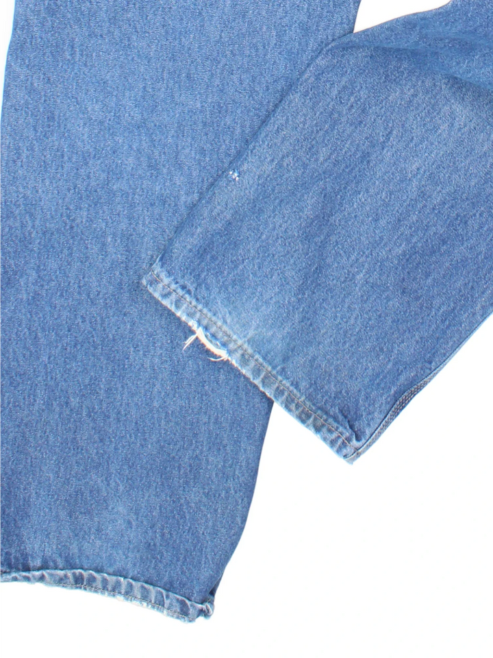 Carhartt Carpenter Jeans in a blue colourway with multiple pockets and the logo embroidered on the back.