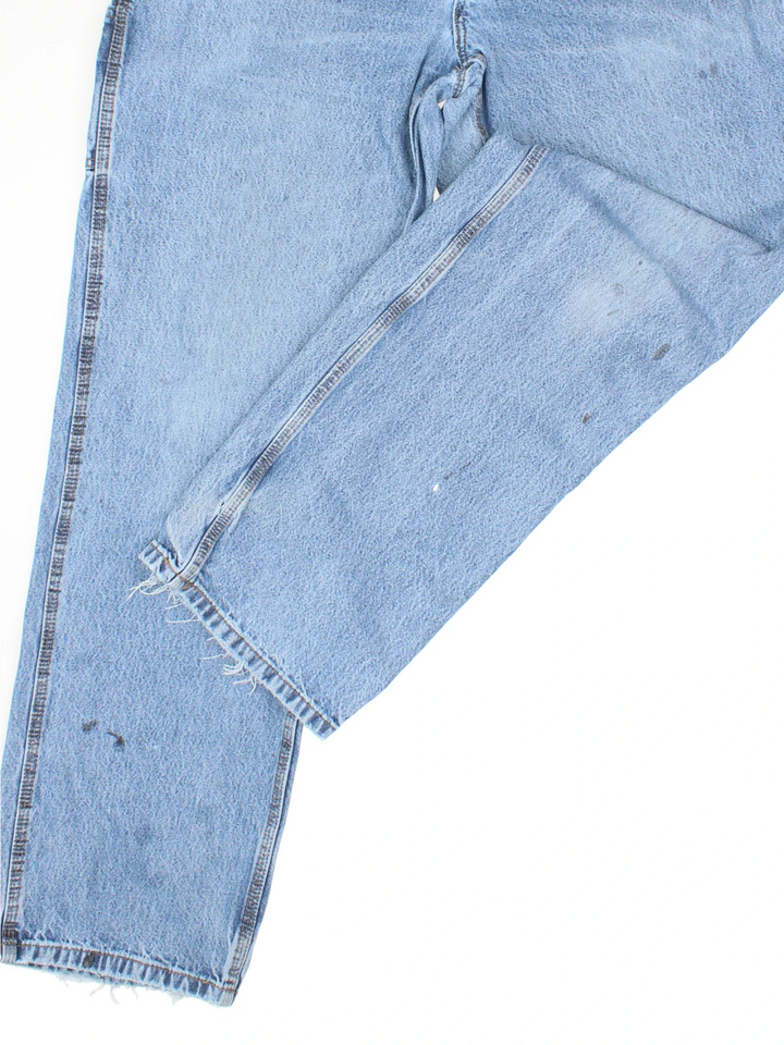 Carhartt Carpenter Jeans in a blue colourway with multiple pockets and the logo embroidered on the back.