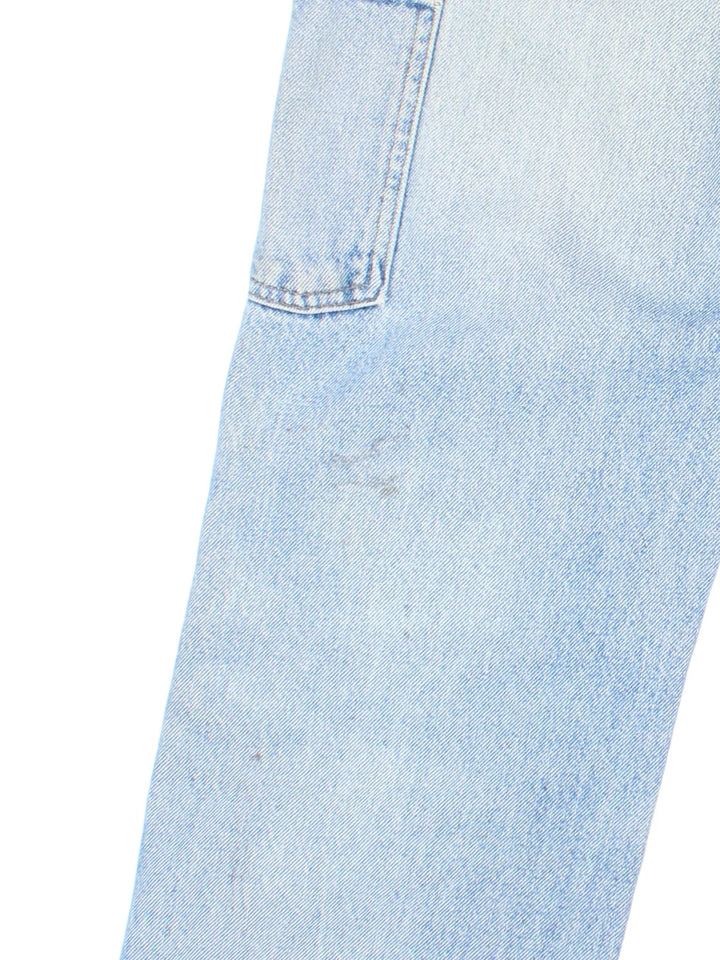 Carhartt Carpenter Jeans in a blue colourway with multiple pockets and the logo embroidered on the back.