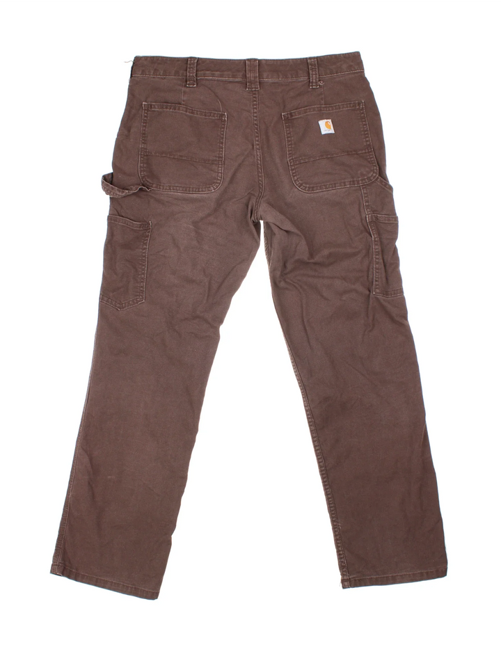 Carhartt Carpenter Trousers in a brown colourway with multiple pockets and the logo embroidered on the back.