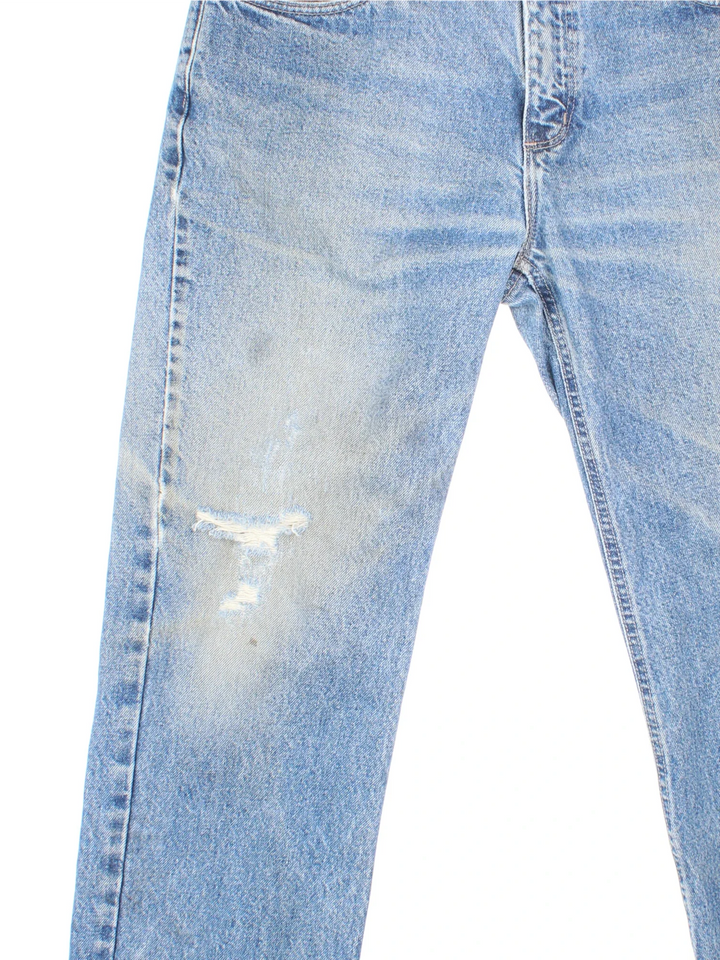 Carhartt Jeans in a blue colourway with multiple pockets and the logo embroidered on the back.