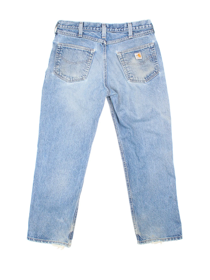 Carhartt Jeans in a blue colourway with multiple pockets and the logo embroidered on the back.
