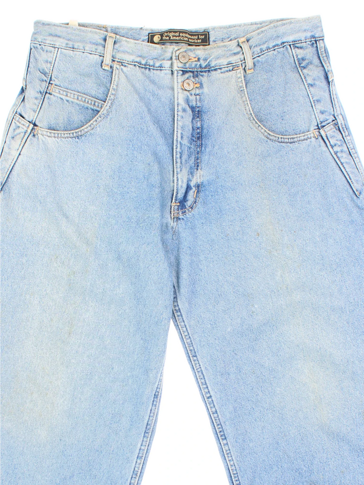 Carhartt Jeans in a blue colourway with multiple pockets and the logo embroidered on the back.
