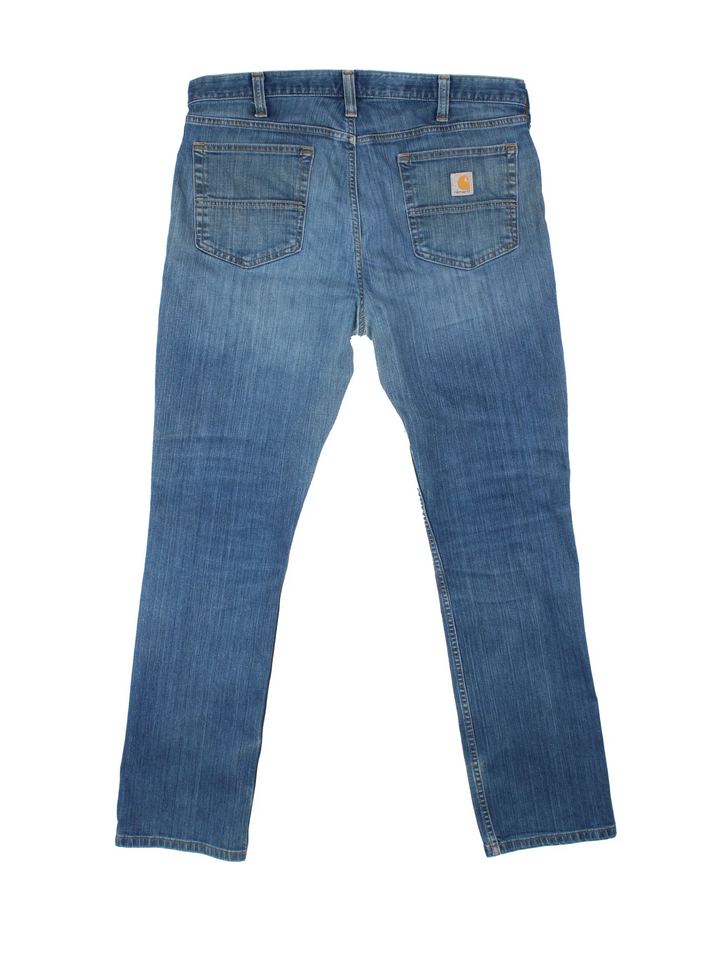 Carhartt Jeans in a blue colourway with multiple pockets and the logo embroidered on the back.