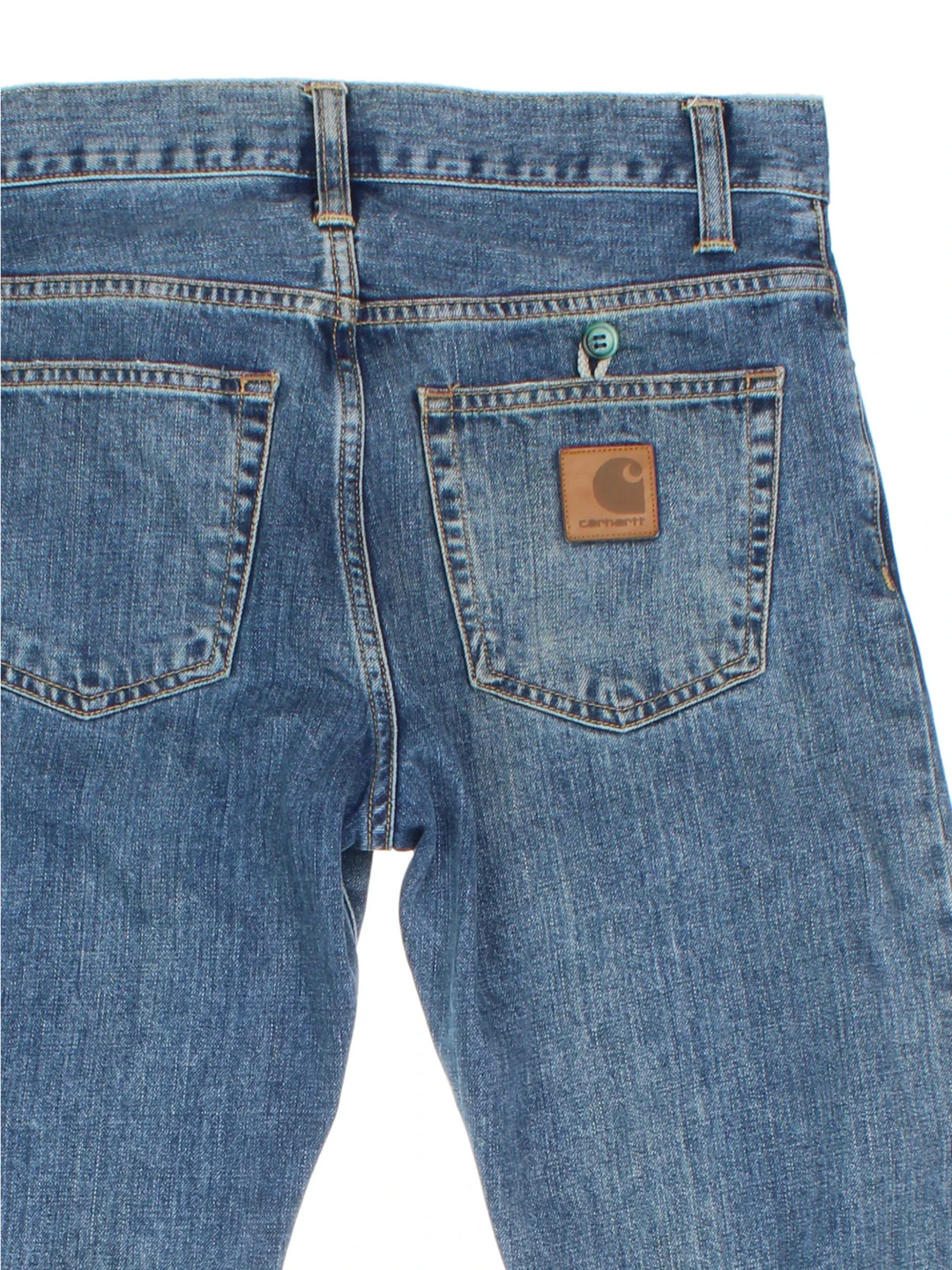 Carhartt Jeans in a blue colourway with multiple pockets and the logo embroidered on the back.