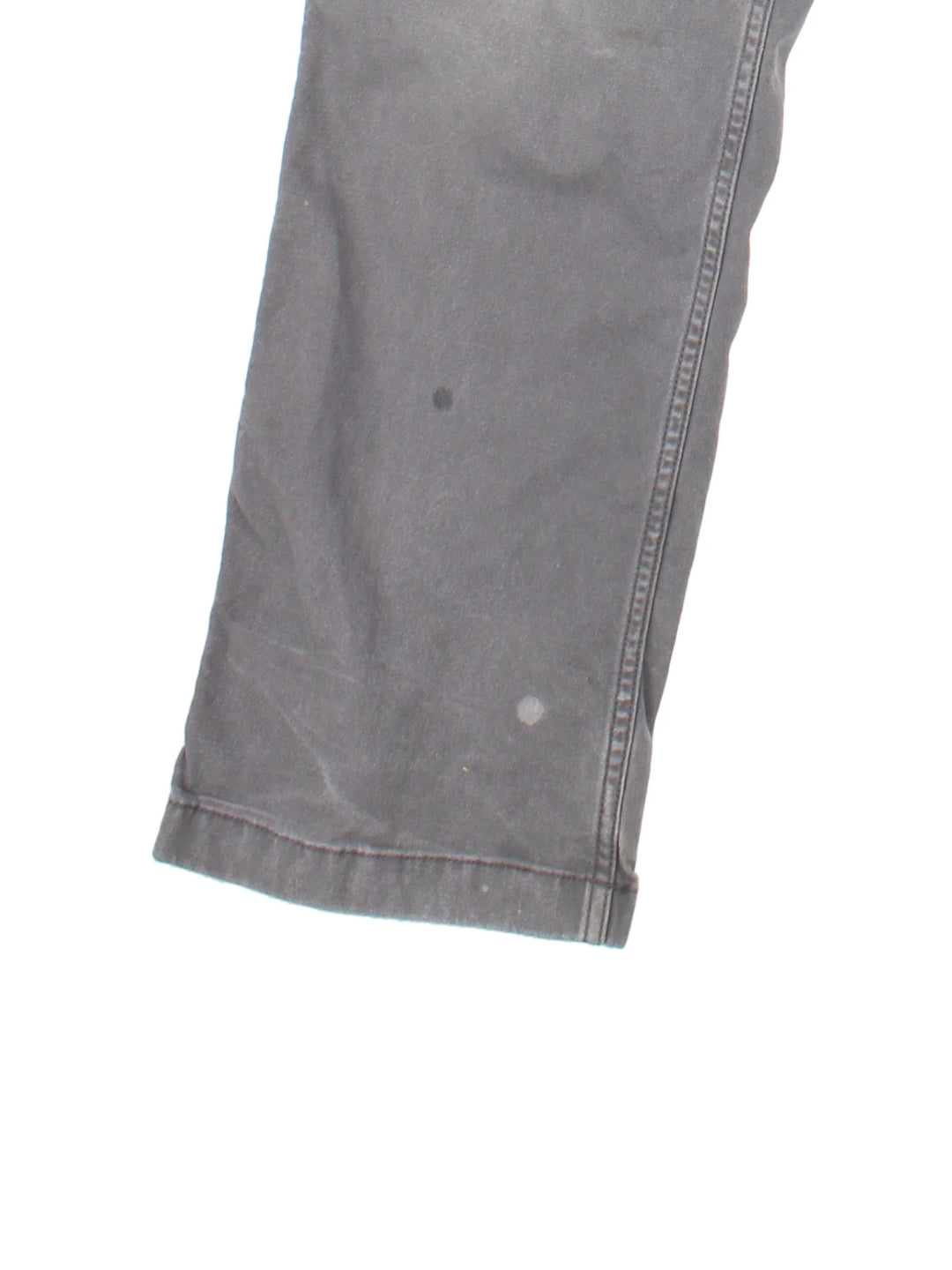 Carhartt Carpenter Trousers in a grey colourway with multiple pockets and the logo embroidered on the back.