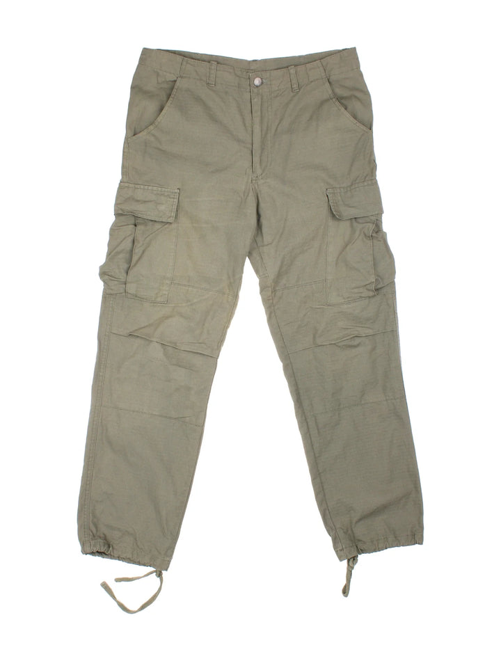 Carhartt Cargo Trousers in a green colourway with multiple pockets and the logo embroidered on the back.