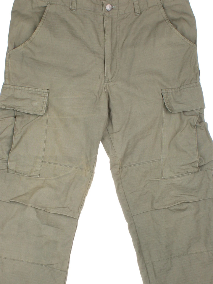 Carhartt Cargo Trousers in a green colourway with multiple pockets and the logo embroidered on the back.