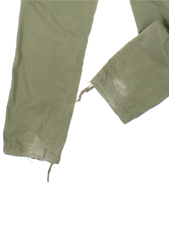 Carhartt Cargo Trouser in a green colourway with multiple pockets and the logo embroidered on the back.