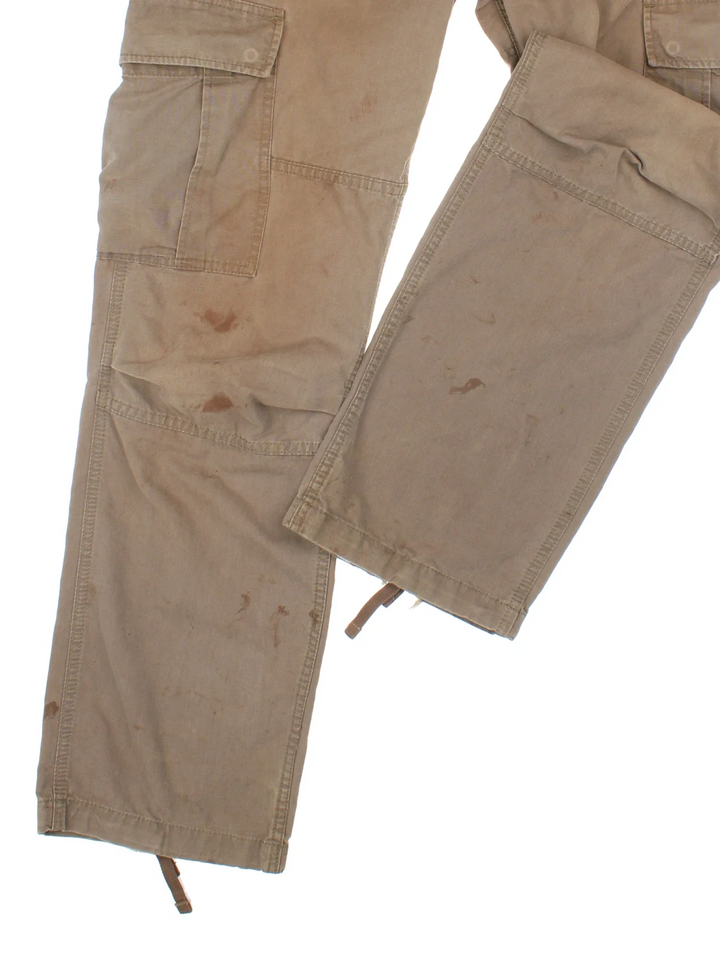 Carhartt Cargo Trousers in a brown colourway with multiple pockets and the logo embroidered on the back.