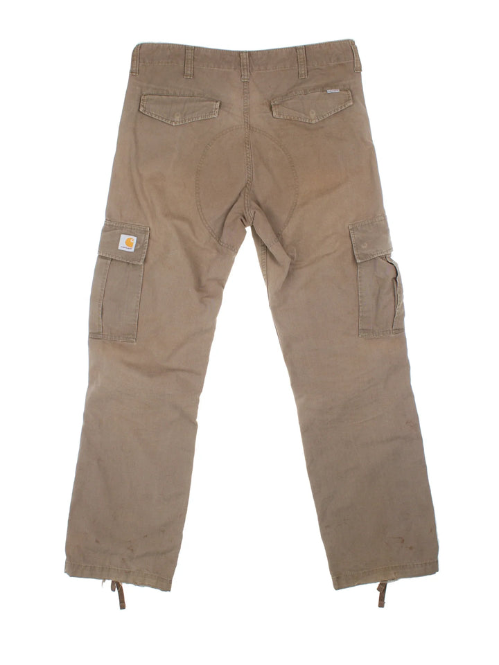 Carhartt Cargo Trousers in a brown colourway with multiple pockets and the logo embroidered on the back.