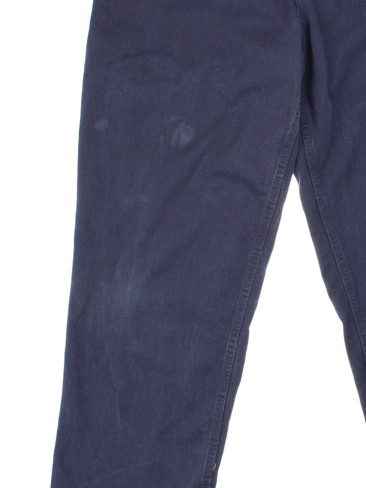 Carhartt Trousers in a blue colourway with multiple pockets and the logo embroidered on the back.
