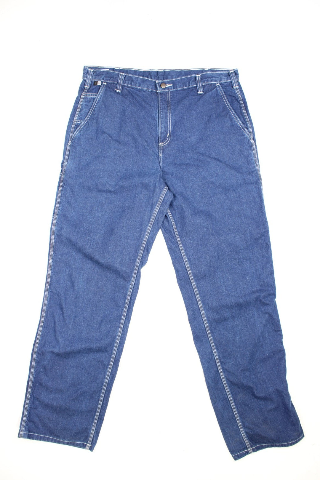 Carhartt Carpenter jeans in a dark blue denim, with white contrast stitching, multiple pockets and the logo embroidered on the back.