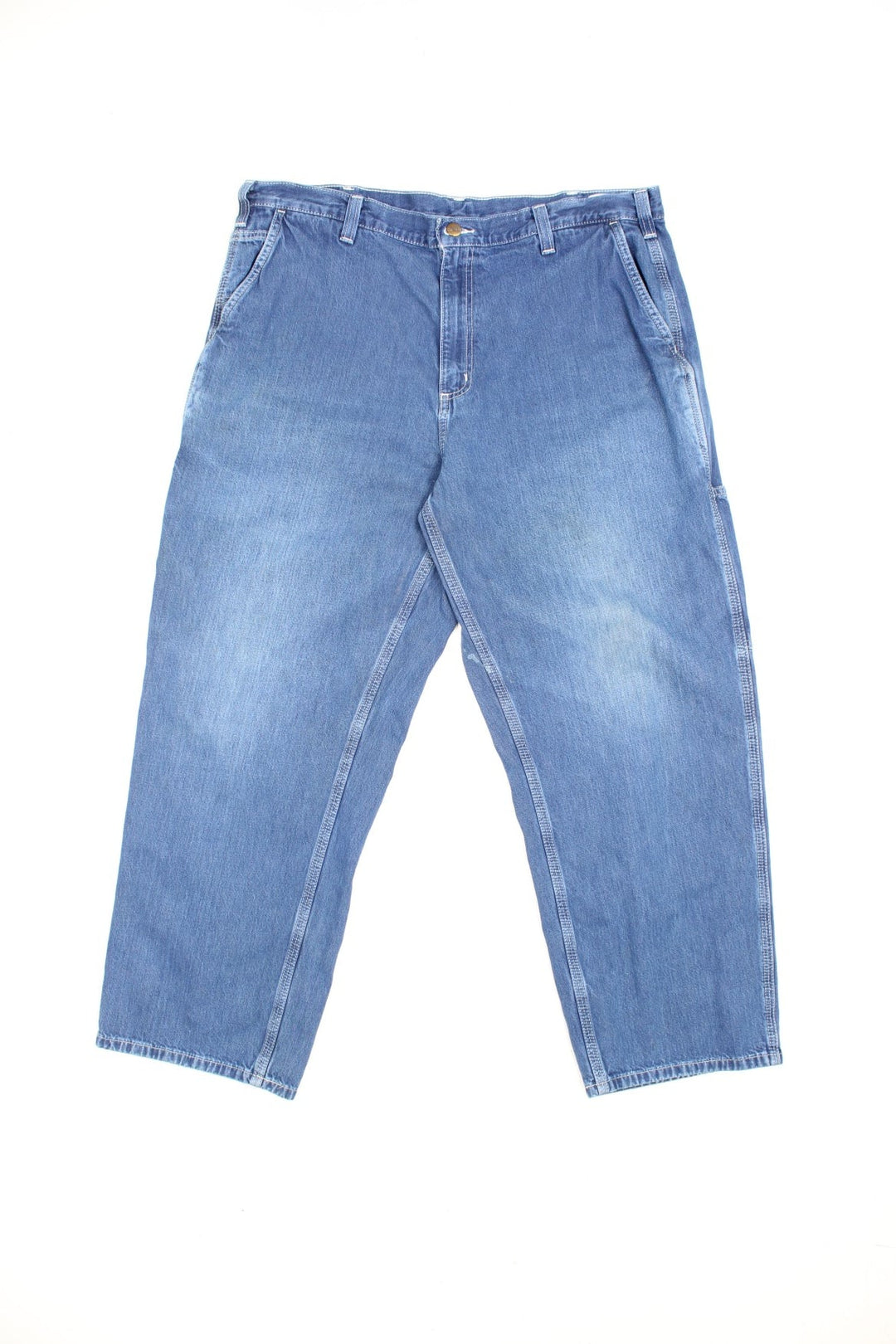 Carhartt Carpenter jeans in a faded blue denim, with white contrast stitching, multiple pockets and the logo embroidered on the back.