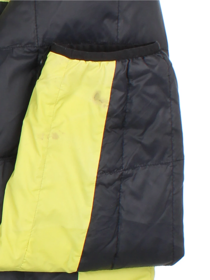 Vintage The North Face Puffer Coat in a black/yellow colourway. Zips up with side pockets, down insulated with elasticated cuffs and hems. Logo embroidered on the front/back.