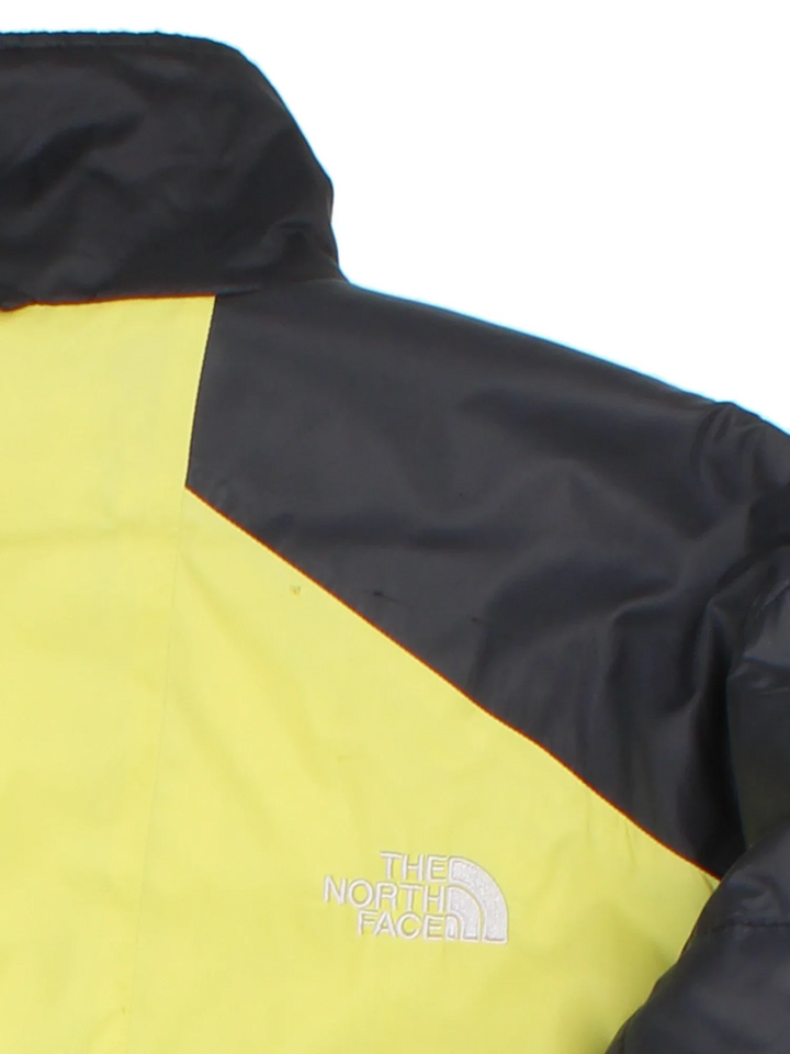 Vintage The North Face Puffer Coat in a black/yellow colourway. Zips up with side pockets, down insulated with elasticated cuffs and hems. Logo embroidered on the front/back.