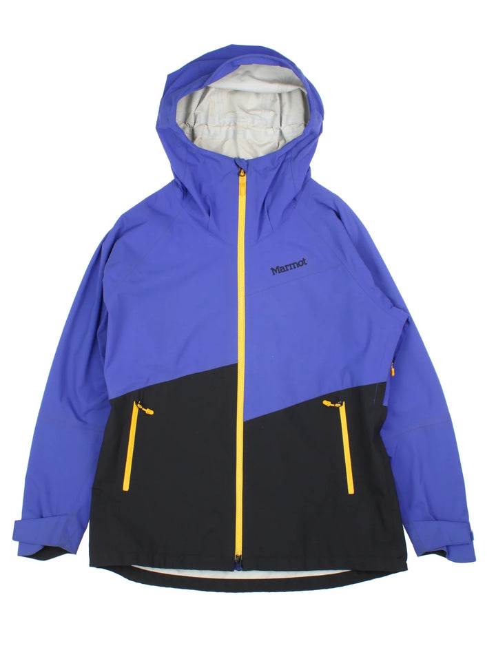 Vintage Marmot Waterproof Jacket in a blue/black colourway. Zips up with side zip pockets, hood and drawstring hem. Logo embroidered on the front and back.
