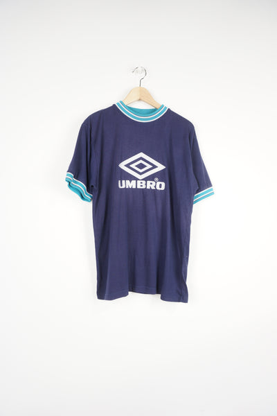 90's navy blue Umbro ringer t-shirt features embroidered spell-out logo across the chest