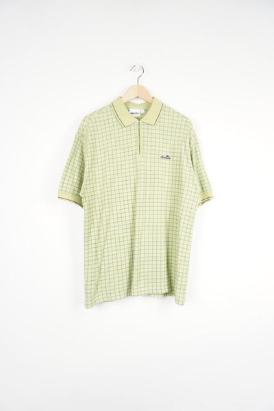 Ellesse green checkered polo shirt features embroidered logo on the chest and a  1/4 zip fastening