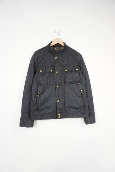 Belstaff  black waxed race master jacket with Belstaff logo on sleeves, plaid lining and buckle detail