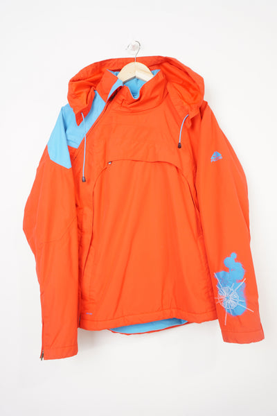 Nike ACG red and blue outdoor coat with foldaway hood and adjustable zip up sides